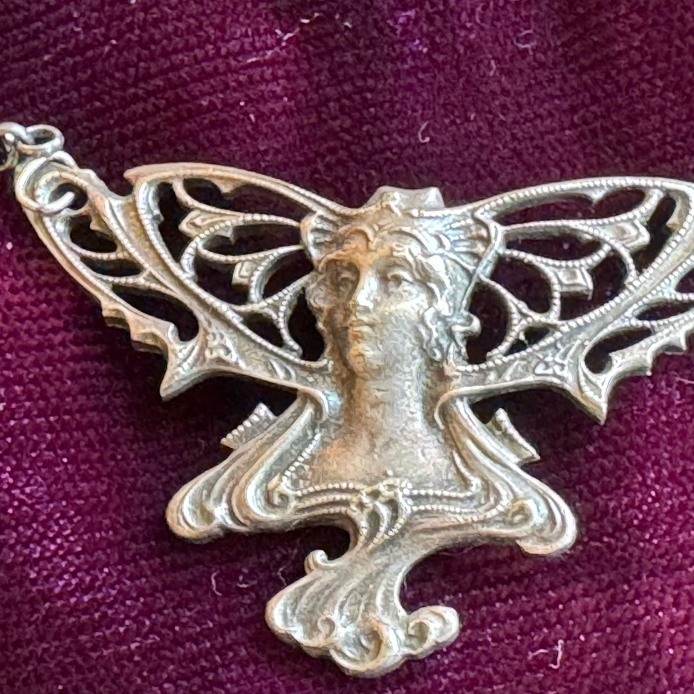 Intricate Silver color Winged Pendant